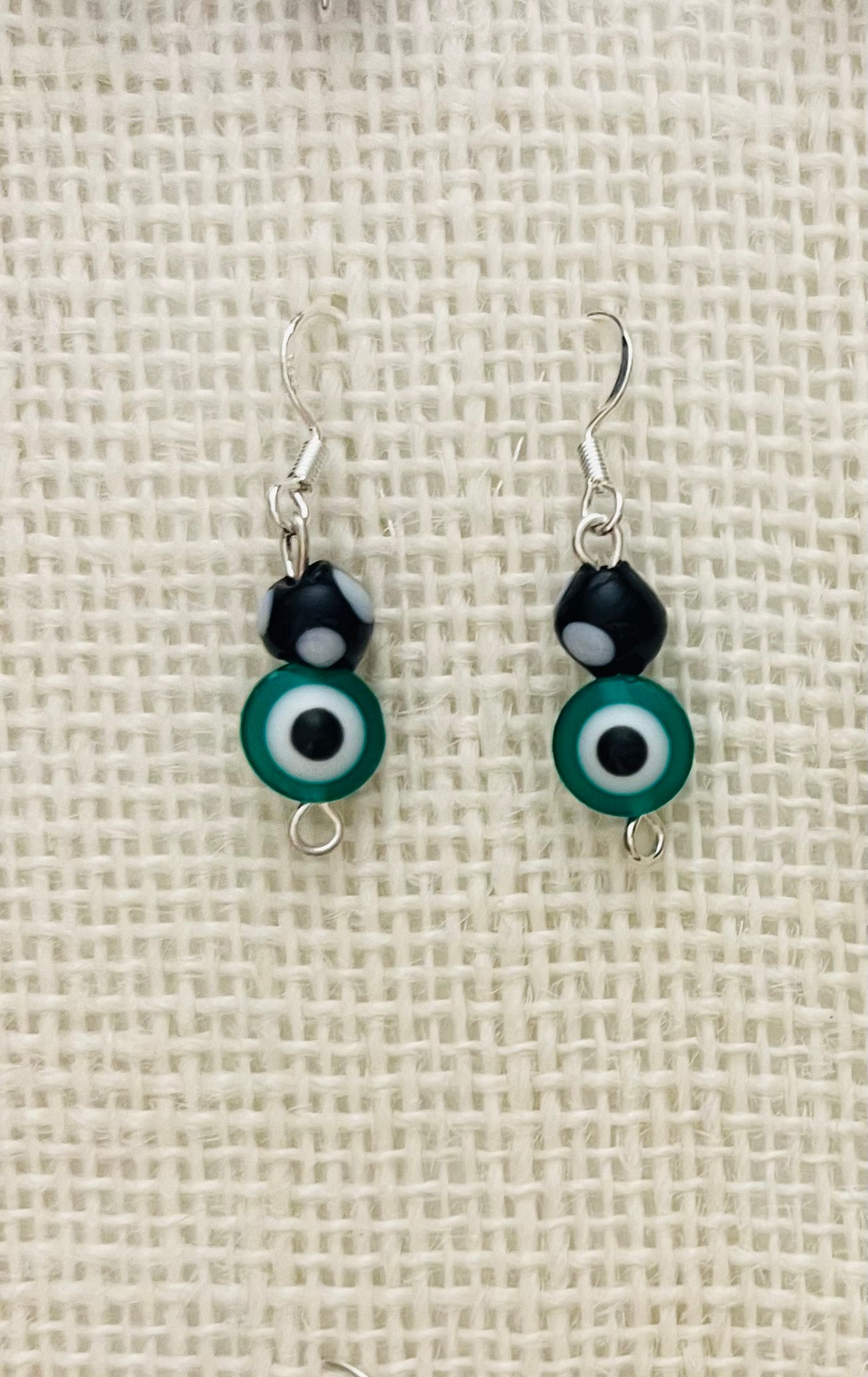 Green evil eye contadiojo earrings
